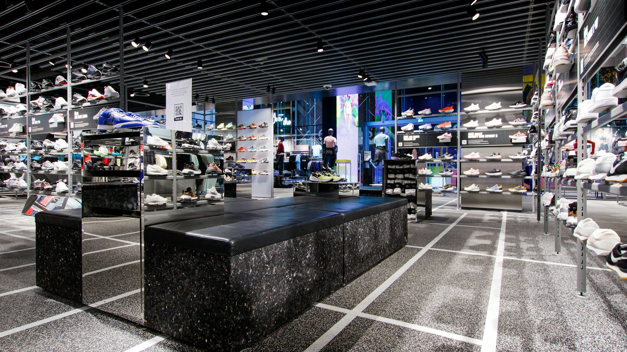 Footwear retail floor, walls of shoes on display